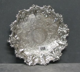 A Victorian engraved silver salver with armorial decoration and bracketed border, raised on 3 pierced panelled supports, London 1840, 14 ozs