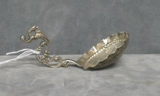 An embossed Dutch silver caddy spoon decorated a Windmill