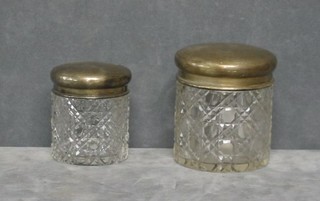 2 circular cut glass dressing table jars with silver lids, Birmingham 1917