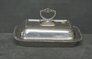 A pair of rectangular silver plated entree dishes and covers