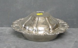 A silver plated muffin dish with vinery decoration