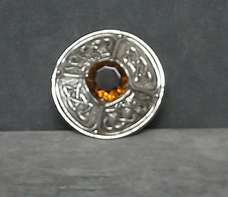 A large circular Scottish brooch set a hardstone