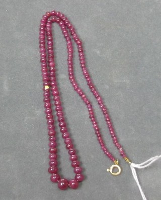 A string of red hardstone beads 19"