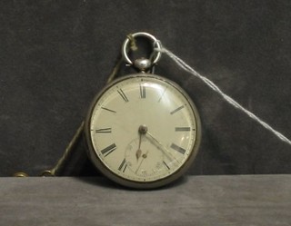 An open faced pair cased pocket watch contained in a silver case