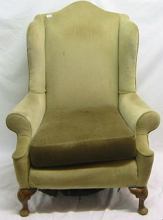 A pair of walnutwood framed Queen Anne style armchairs upholstered in green material