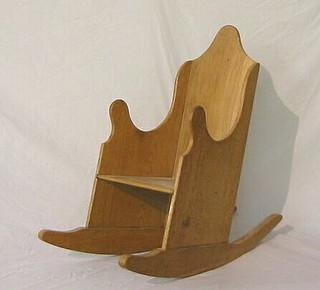 A childs elm rocking chair