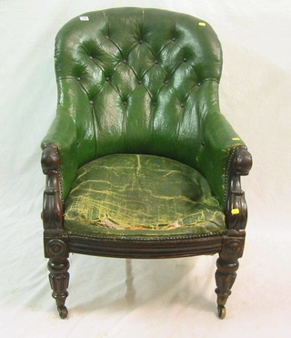 A William mahogany show frame library chair upholstered green buttoned rexine, raised on turned and reeded supports