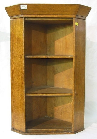 An oak open hanging corner cabinet 18"