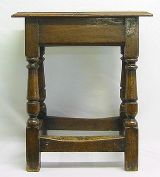 A 19th Century rectangular oak joyned stool, raised on turned and block supports 18"