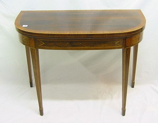 A Georgian rosewood card table with crossbanded top, fitted a frieze drawer and raised on square tapering supports ending in spade feet 38"