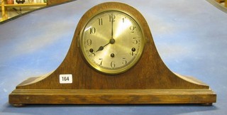 A 1930's striking clock with silvered dial contained in an oak "Admiral's hat" case