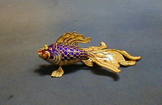 A modern gilt metal and blue enamelled model of an articulated fish, cased