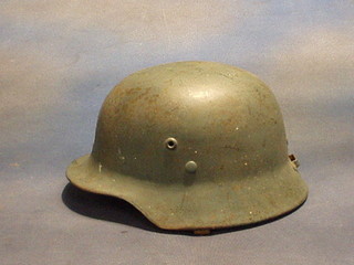 A "Serbian" steel helmet, the leather lining marked KAB