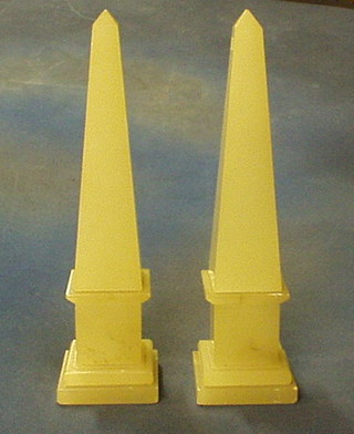 A pair of white marble obelisks 14"