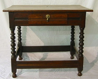 An 18th/19th Century oak side table fitted a drawer and raised on bobbin turned supports with plank stretcher 35"