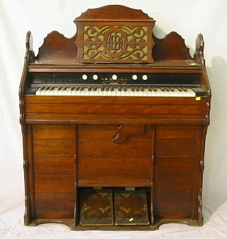 A Victorian Harmonium by W Bennett of Richmond in a walnutwood case 39"