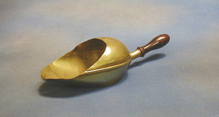 A brass grain scoop