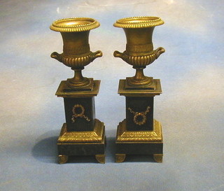 A pair of 19th Century gilt metal and iron twin handled urns 11"