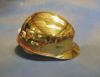 A "novelty" gold plated safety helmet made for Chubb