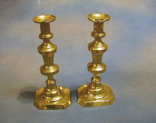 A pair of brass candlesticks with ejectors 10" 