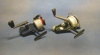 An Abu model maker's cardinal 40 multiplying fishing reel and an Abu cardinal 44 x multiplying fishing reel