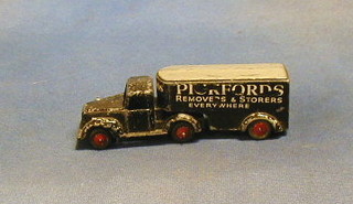 A Timpo toy Pickford's Removals and Storage articulated lorry, a Dinky jeep, a Dinky ambulance, road roller, a Chareens fire engine and 2 motor cars