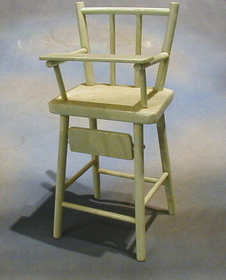 A turquoise painted dolls high chair