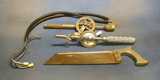 An amputation saw by Allen & Hensburys, a stethoscope by GP Pilling & Sons, 2 hand drills and 2 syringe boxes and a pair of tongs