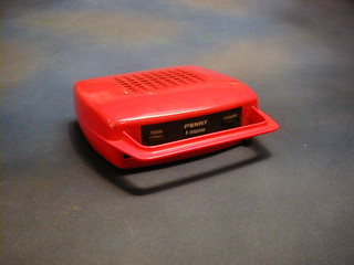 A 1970's Italian "Penny" 45rmp handbag record player  in a red plastic case