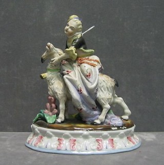 A 19th Century Continental biscuit porcelain figure group of a girl on a goat 9"