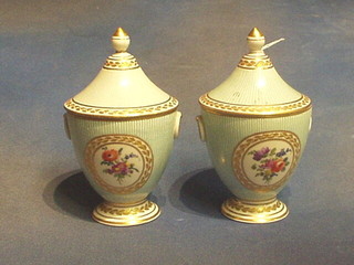 A pair of 19th Century "Sevres" porcelain urns and covers with turquoise and white striped decoration, having oval panels decorated flowers, 8" (r)
