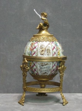 A 19th Century Continental porcelain trinket box in the form of an egg with gilt metal mounts (very f) 8"