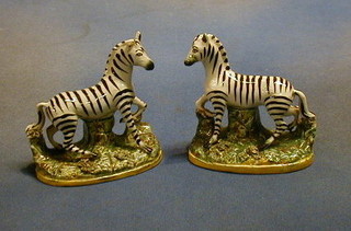 A pair of Staffordshire figures of Zebras 5" (ears chipped, slight chip to base)