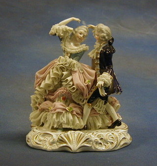A Continental porcelain figure of a crinoline lady and gentleman 9" (f and r)