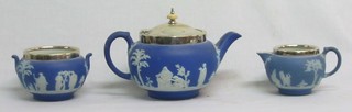 A Wedgwood blue Jasperware 3 piece tea service - teapot, cream jug and sugar bowl, marked Wedgwood