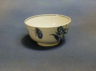 An 18th Century blue and white porcelain tea bowl with floral transfer decoration, the base marked S