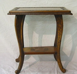 A rectangular carved hardwood 2 tier occasional table on cabriole supports 25"