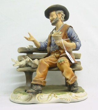 A "Capo di Monte" figure of a seated tramp 12"