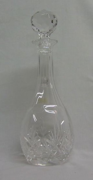 A cut glass club shaped decanter