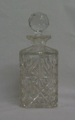 A cut glass spirit decanter and stopper