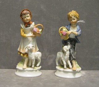 A pair of modern porcelain figures of a boy and girl, 2 biscuit porcelain figures  and 1 other (5)