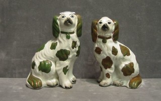 A pair of Staffordshire figures of seated Spaniels 7"