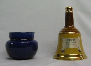 A blue glazed pottery tobacco jar and a Wade Bells whisky decanter (2)