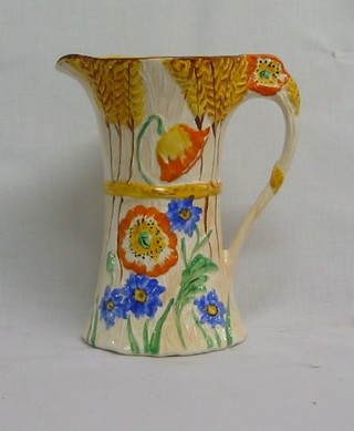 A Wetherby 1930's pottery jug decorated flowers 7" and a Royal Crown Devon jug 8" (f and r)