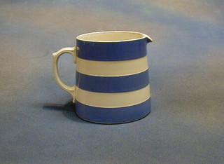 A T G Greener blue and white banded jug, the base with green sheild mark and incised 17, (crack to base) 5"