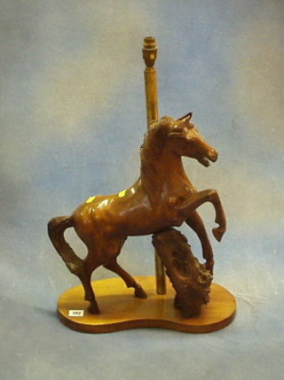 A carved wooden table lamp in the form of a rearing horse 18"
