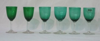 8 green glass wine glasses with clear glass stems