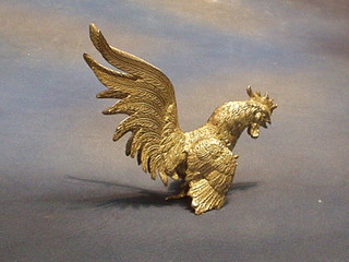 A silver plated table ornament in the form of a fighting cock 7"