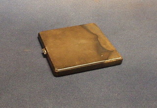 A silver cigarette case with engine turned decoration Birmingham 1935