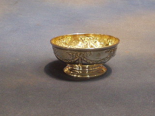 An antique silver pedestal bowl with later embossing, hallmarked London, 4 ozs